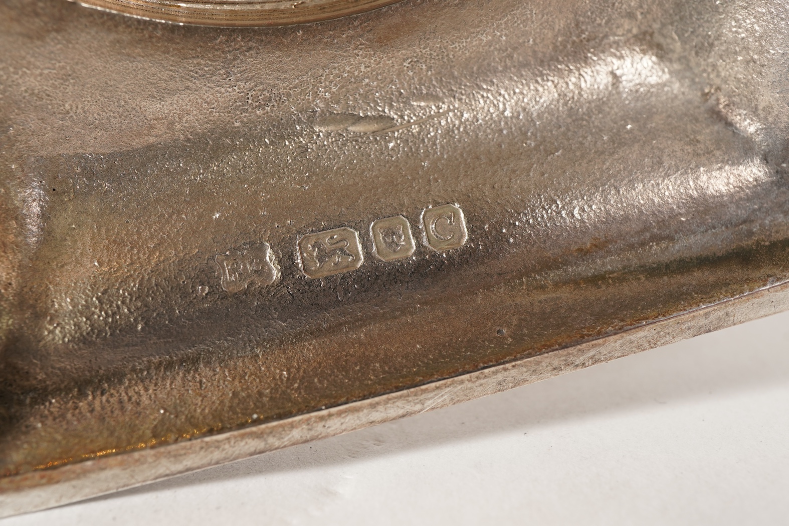 An Elizabeth II silver three branch, three light candelabrum, by William Comyns & Sons Ltd